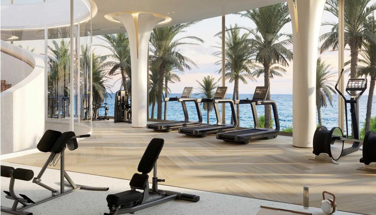Podium-level fitness suite facing the sea