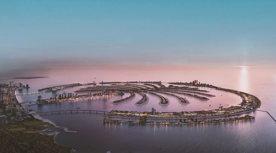 Palm island aerial at dusk