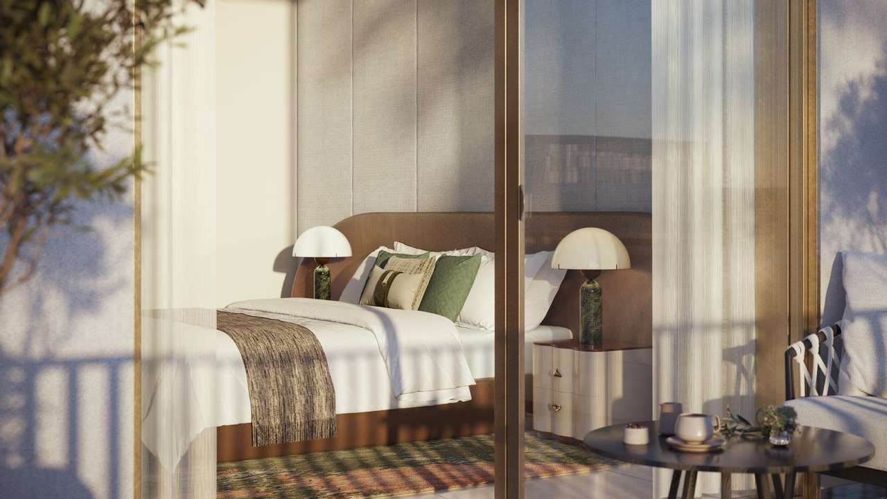 Bedroom interior opening onto a balcony
